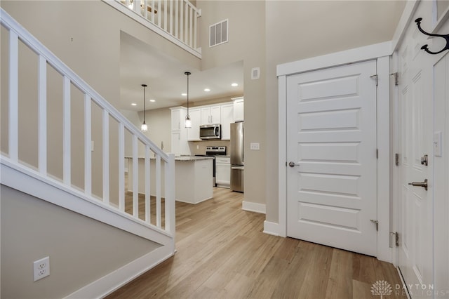 foyer entrance featuring light hardwood / wood-style flooring