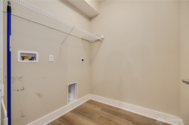 laundry area featuring electric dryer hookup, wood-type flooring, and washer hookup