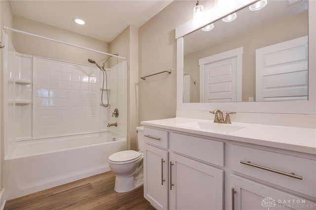 full bathroom featuring shower / bathing tub combination, toilet, vanity, and hardwood / wood-style flooring