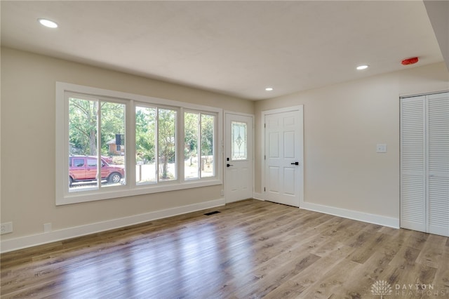 spare room with light hardwood / wood-style floors