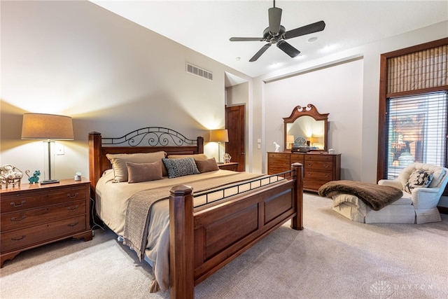 carpeted bedroom featuring ceiling fan and lofted ceiling