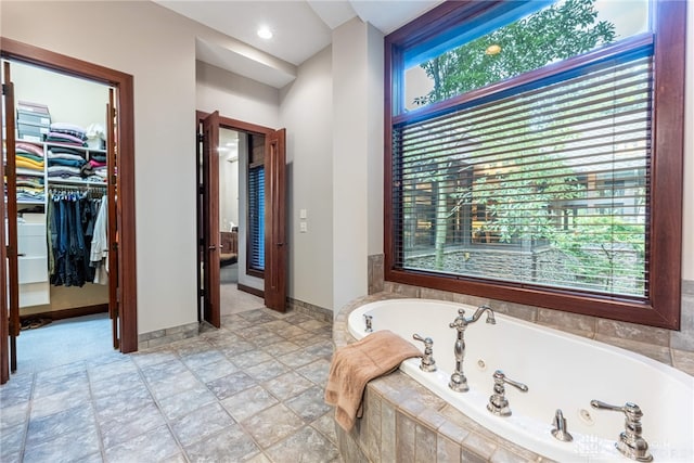 bathroom with tiled bath