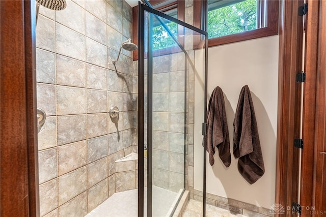 bathroom with a shower with shower door