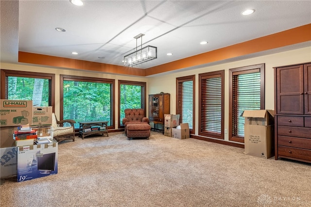 sitting room with carpet flooring and a healthy amount of sunlight