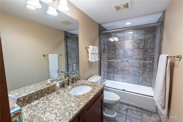 full bathroom with vanity, toilet, and enclosed tub / shower combo