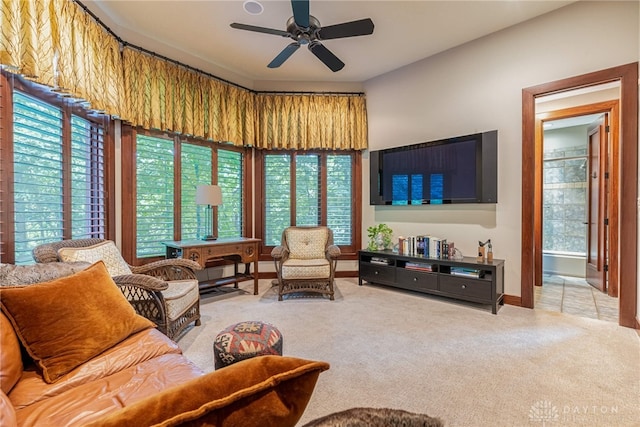 living room featuring carpet flooring and ceiling fan