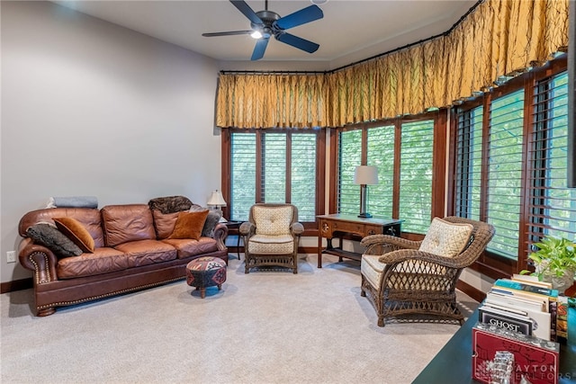 living room featuring carpet and ceiling fan