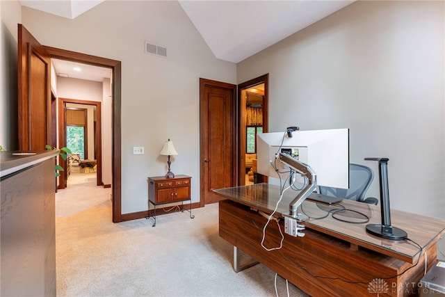 office area with light carpet and lofted ceiling