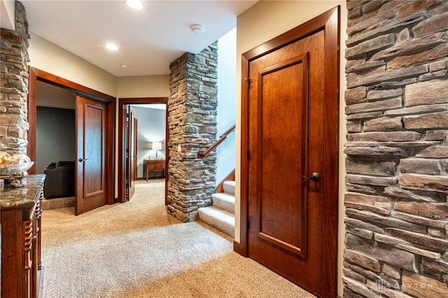 corridor with light colored carpet