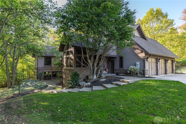 view of front of home with a front yard, a garage, and a sunroom