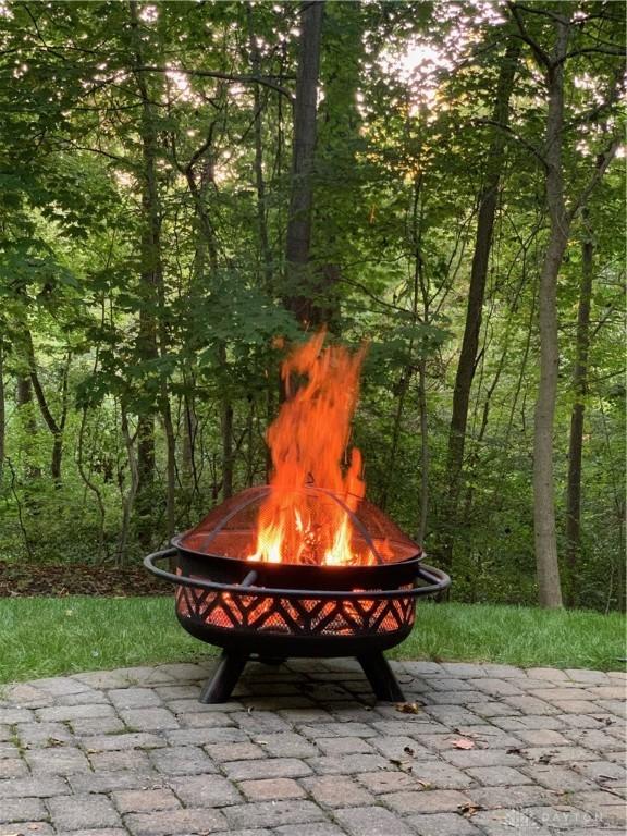 view of community featuring a fire pit