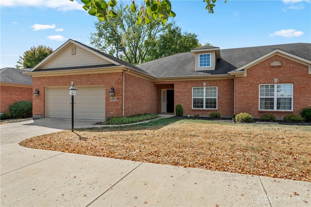 view of front of house with a garage and a front yard