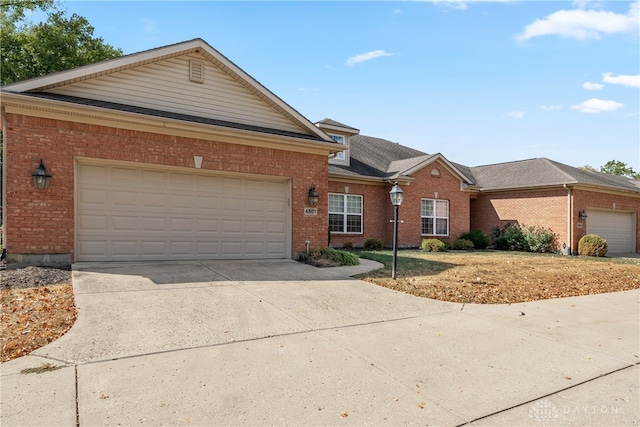 ranch-style home featuring a garage