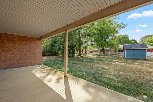 view of patio / terrace with a shed