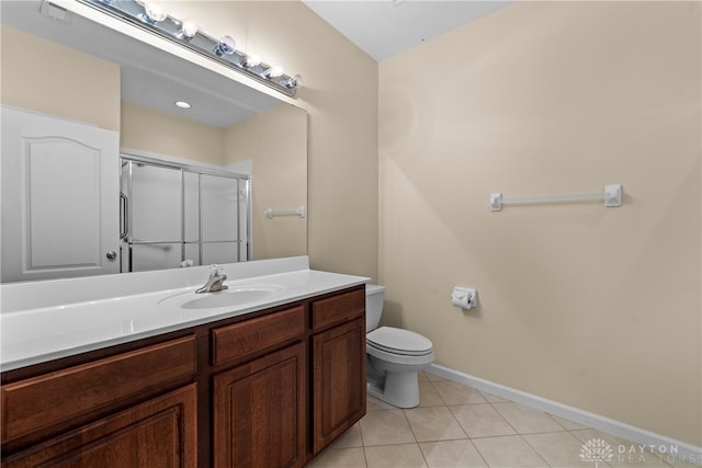 bathroom with walk in shower, toilet, vanity, and tile patterned floors