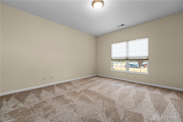 empty room with carpet flooring