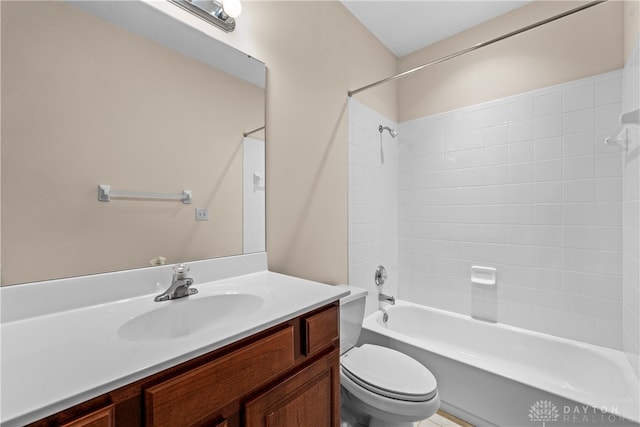 full bathroom featuring vanity, toilet, and tiled shower / bath