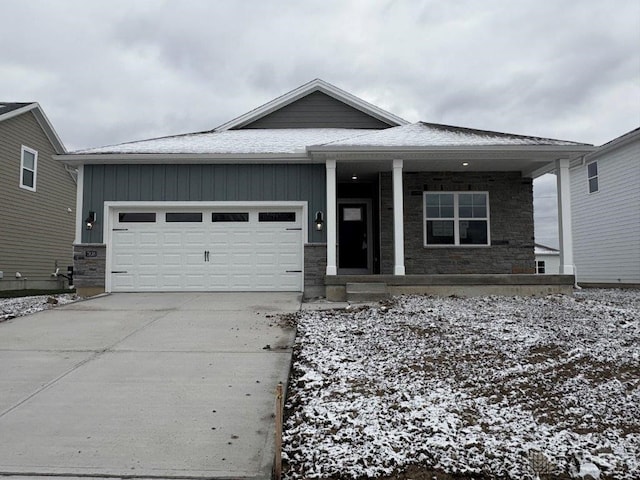 view of front facade with a porch and a garage