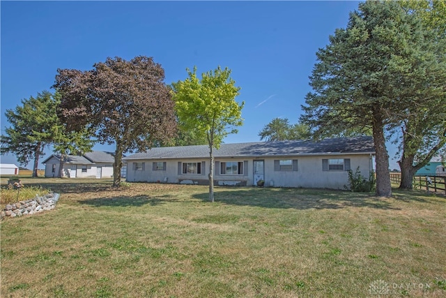 rear view of house with a lawn