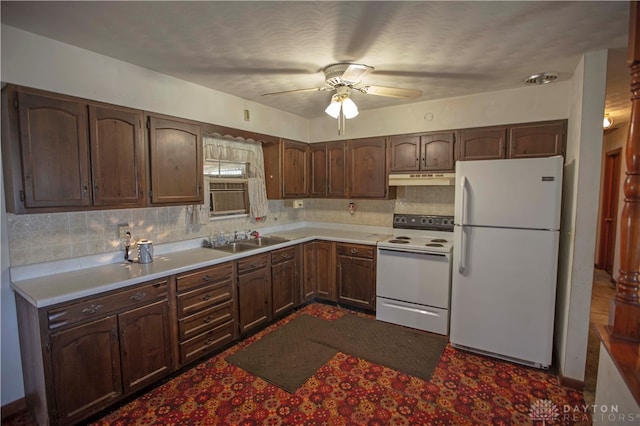 kitchen with ceiling fan, sink, white appliances, dark brown cabinets, and decorative backsplash