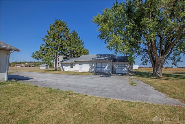 view of outbuilding with a yard