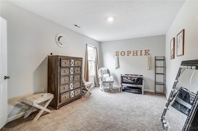 sitting room featuring carpet