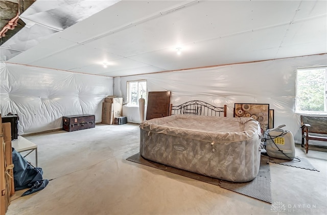 bedroom featuring concrete floors and pool table