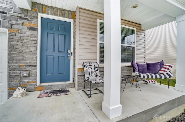 entrance to property with a porch