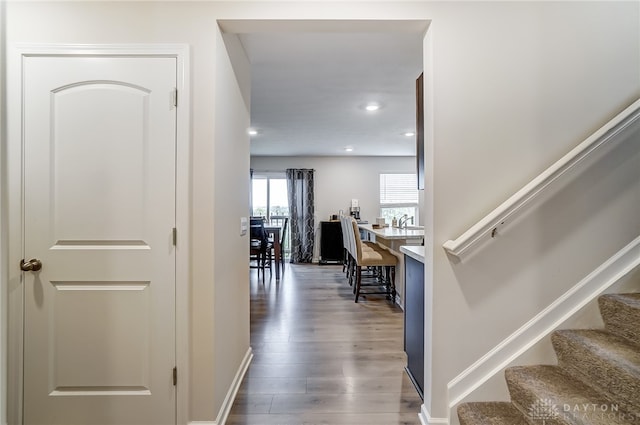 corridor featuring dark wood-type flooring