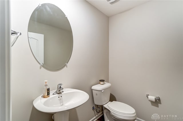 bathroom with toilet and sink