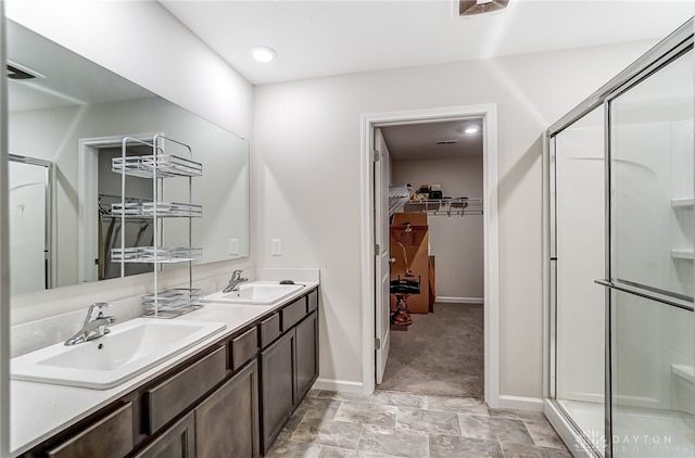 bathroom with an enclosed shower and vanity