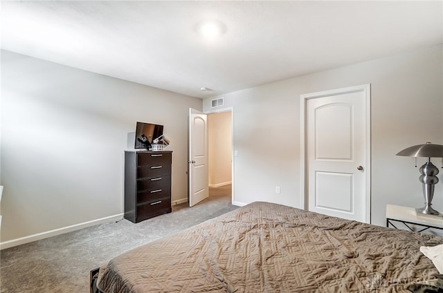 bedroom with light colored carpet