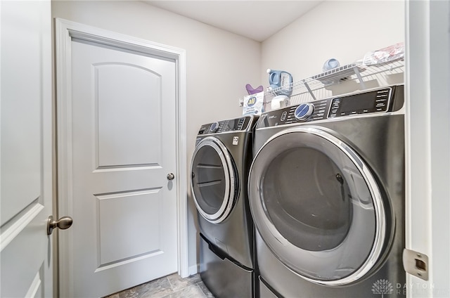 clothes washing area featuring washing machine and clothes dryer