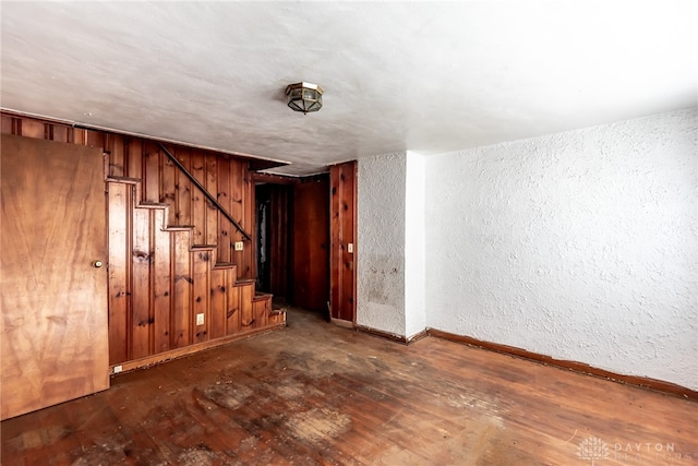 unfurnished room with dark wood-type flooring