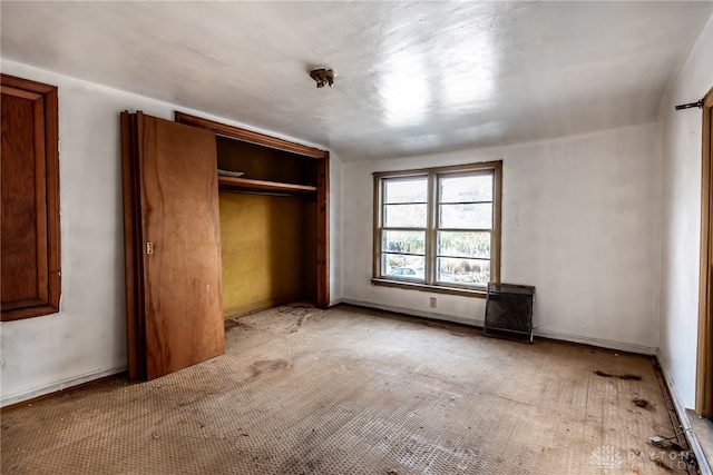 unfurnished bedroom with a closet