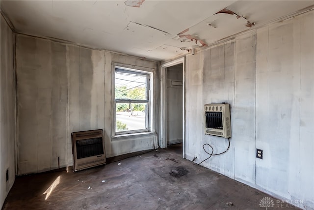 unfurnished living room with heating unit