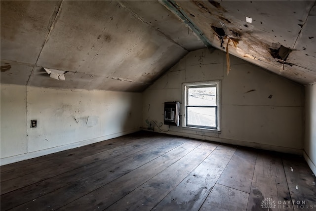 bonus room featuring vaulted ceiling and hardwood / wood-style flooring