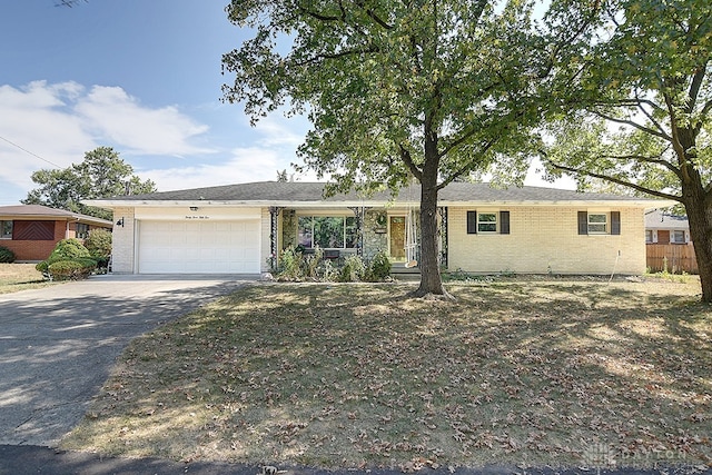 ranch-style home featuring a garage