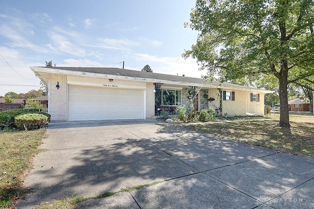 ranch-style house featuring a garage