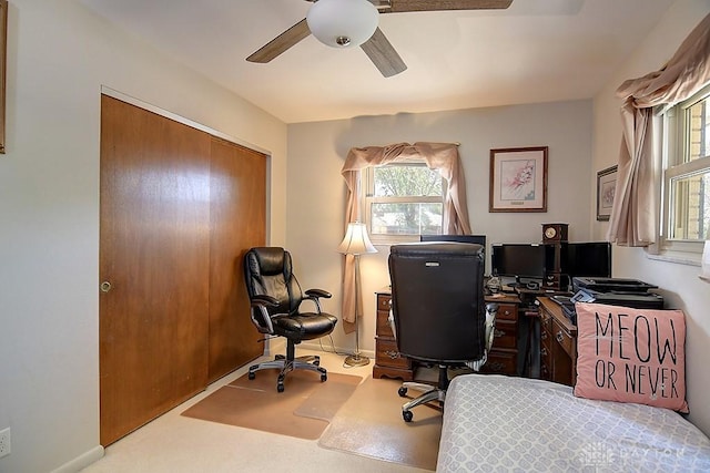 office area with baseboards and a ceiling fan