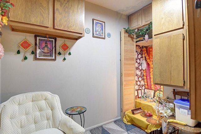 sitting room featuring baseboards