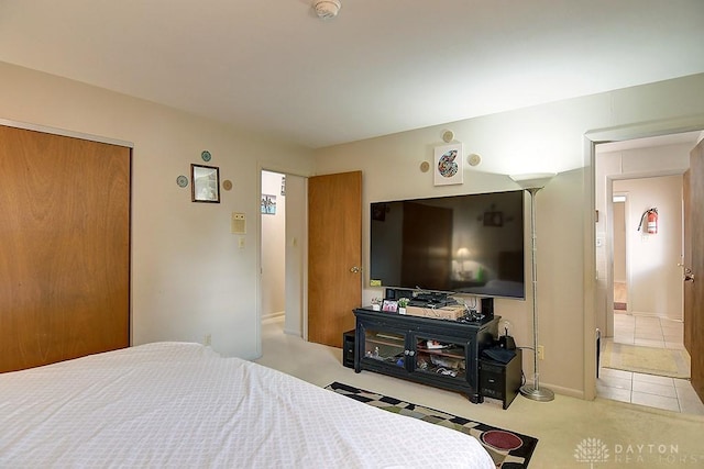 carpeted bedroom featuring a closet