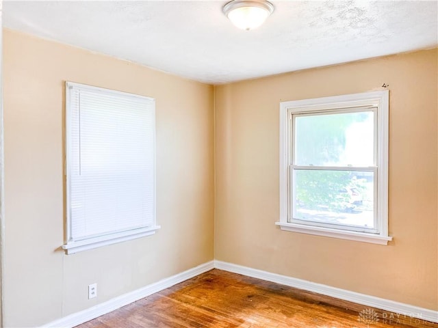 unfurnished room featuring wood-type flooring