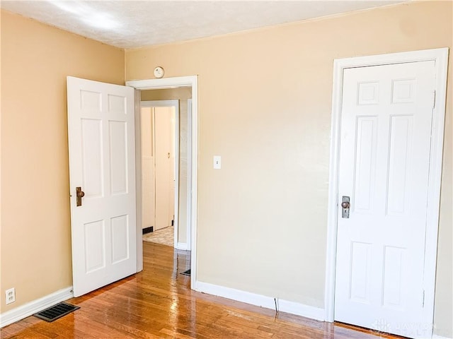 unfurnished room featuring light hardwood / wood-style flooring