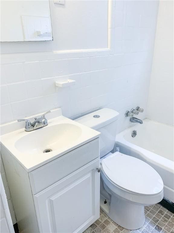 full bathroom featuring vanity, toilet, and shower / washtub combination