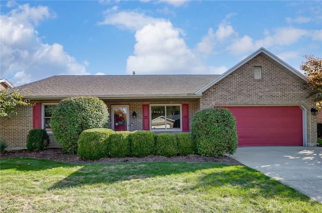 ranch-style home with a garage and a front yard