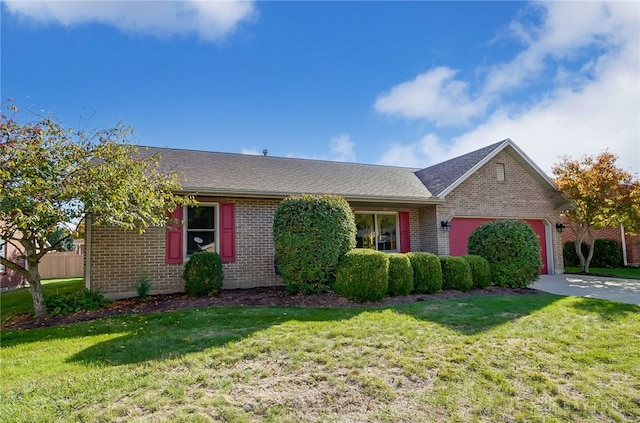 ranch-style home featuring a garage and a front lawn