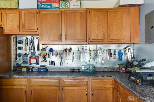 kitchen featuring tasteful backsplash and electric panel