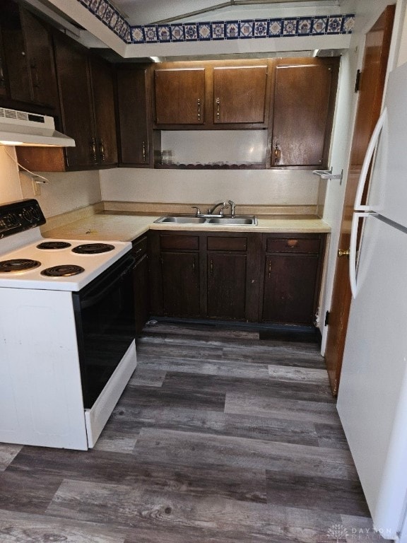 kitchen featuring dark brown cabinetry, sink, white appliances, dark hardwood / wood-style floors, and range hood