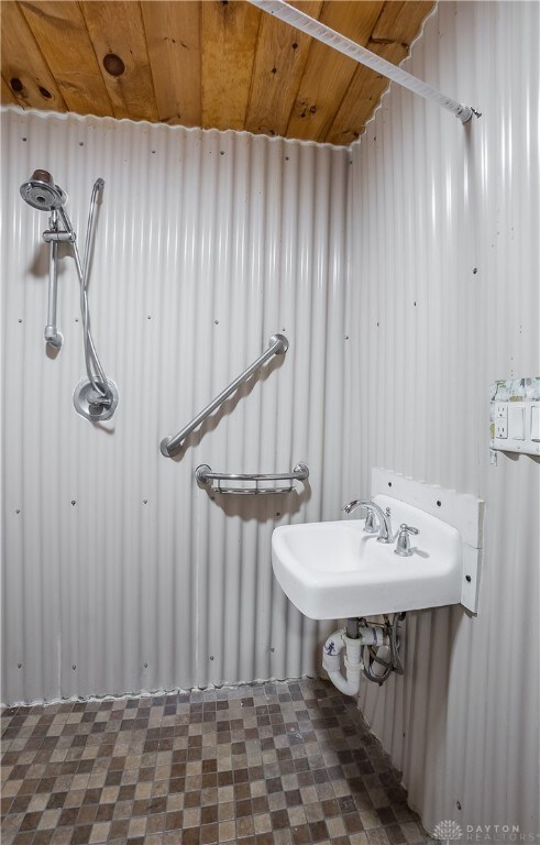 bathroom with wood ceiling